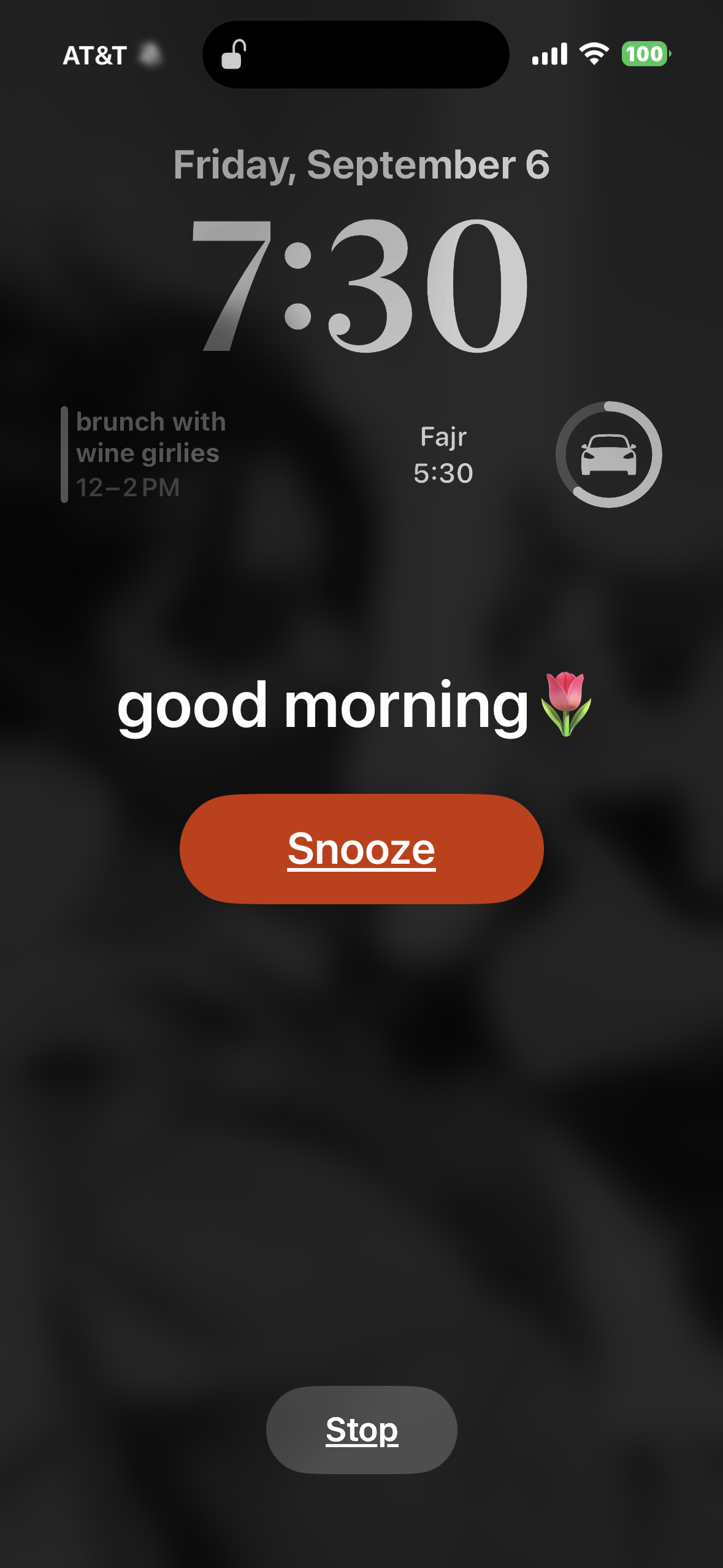 phone lock screen with alarm clock that is saying good morning